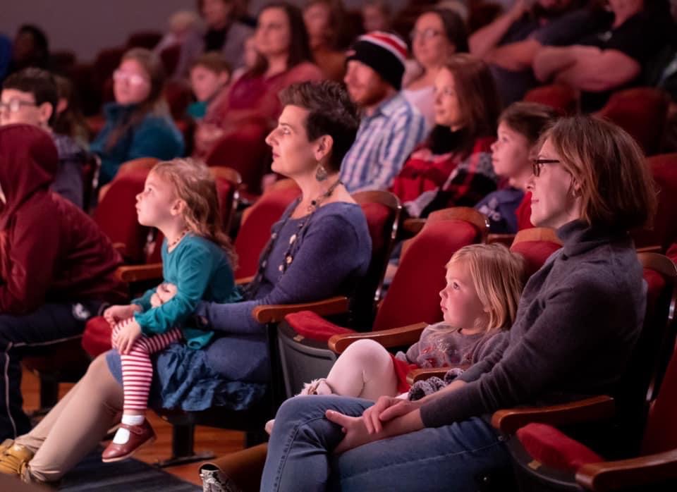 Children sitting in the audience